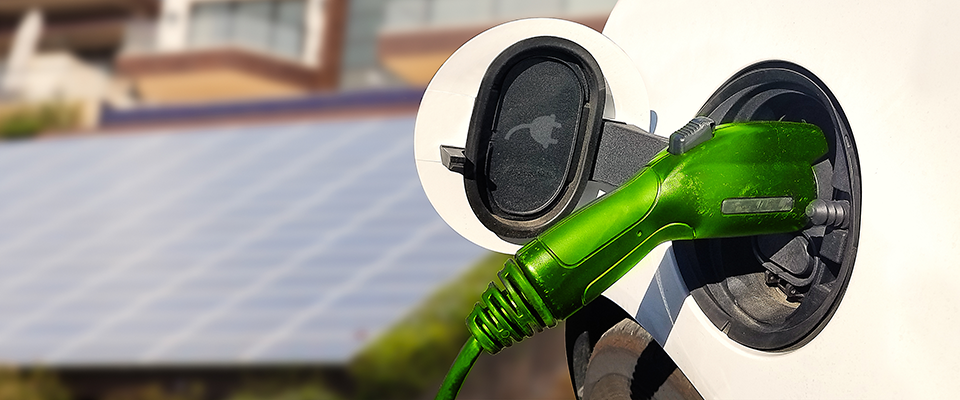 Electrical vehicle charging equipment - EVCE - plugged into car.